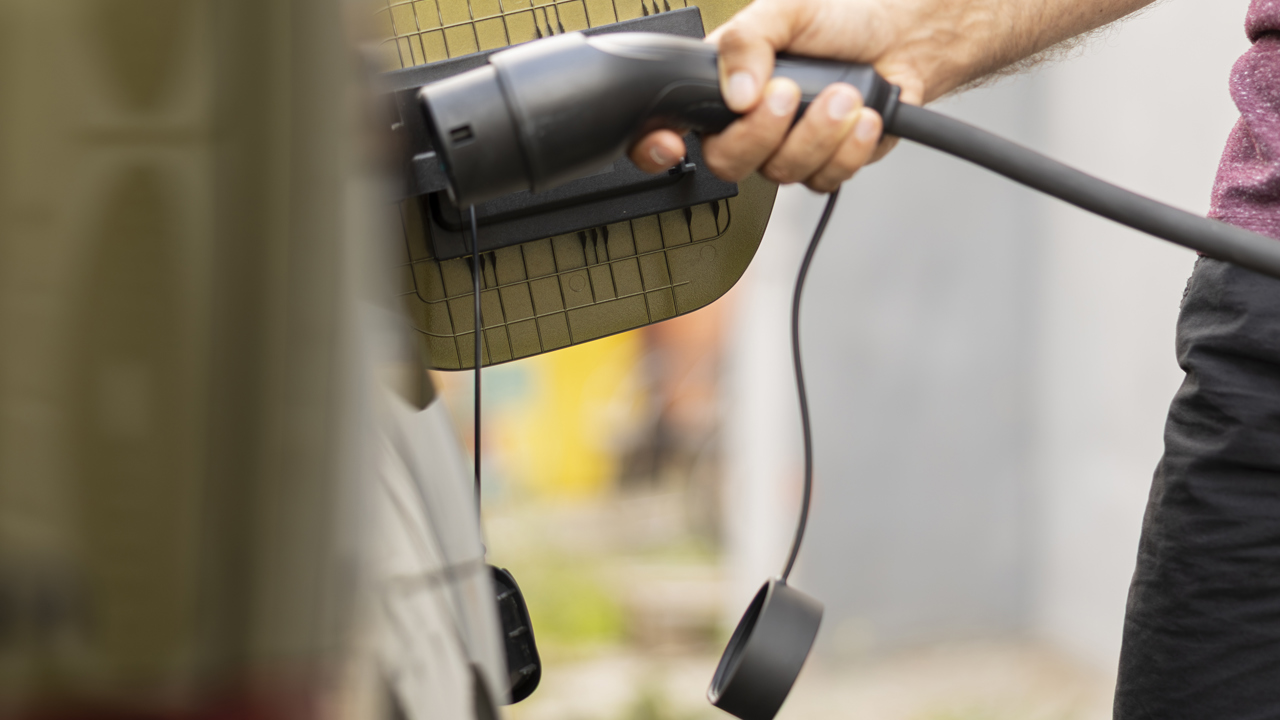 Mp68625994 Close Up Shot Of Man Charging Ev Vehicle Parked At Station